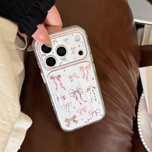 Close-up of pink leopard bow patterns on a transparent iPhone case with star details.
