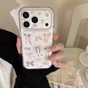 Detailed view of clear iPhone case with pink leopard bow patterns and camera protection