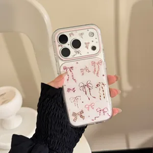 Detail of transparent iPhone case with pink leopard bow patterns and raised camera bezel