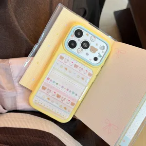 Detailed view of a cute yellow iPhone case featuring cartoon animal stickers on a notebook