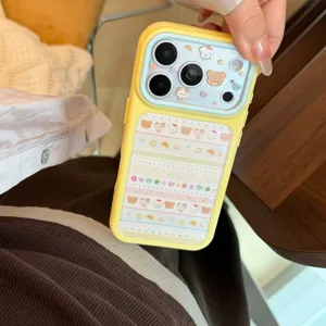 Close-up of cute yellow iPhone case featuring cartoon animal patterns and blue lens cover