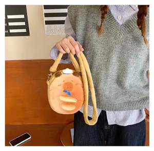 Cute Capybara plush crossbody bag shown being held by a student in a casual outfit