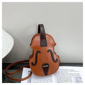 Detailed view of the unique violin-shaped leather crossbody bag with fine stitching details