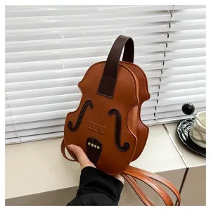 Detail view of a unique violin-shaped fashion handbag with creative instrument design