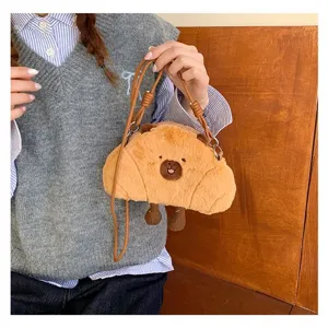 Cute plush capybara crossbody bag for girls, featuring soft brown fur and lovely cartoon face
