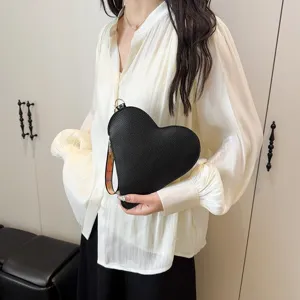 Bolso de mano de cuero negro con forma de corazón para mujer, estilo de moda 2025