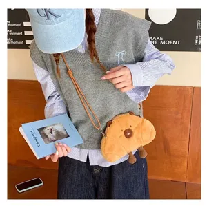 Detailed view of the cute plush Capybara crossbody bag worn by a student in lifestyle setting