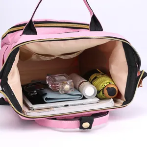 Mochila pañalera rosa de gran capacidad para mamás con compartimentos interiores