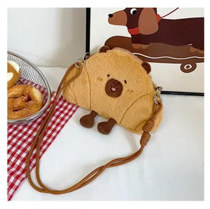 Cute plush Capybara crossbody bag for kids featuring a unique croissant-shaped design
