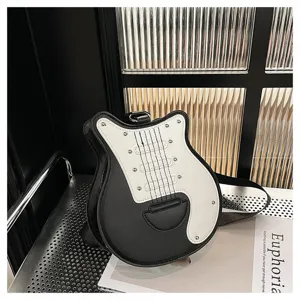 Close-up detail of the guitar-shaped crossbody bag featuring a black and white contrast design