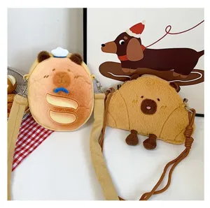 Two cute Capybara bread-shaped plush crossbody bags with soft fleece straps for kids