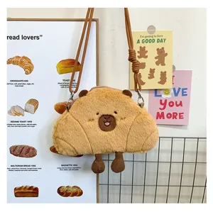 Detailed view of the cute capybara plush crossbody bag with a soft croissant shape design