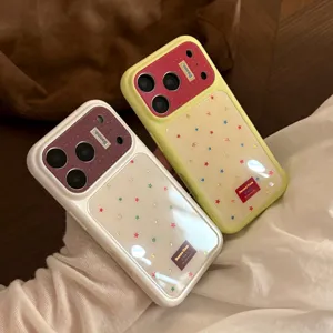 Close-up of stylish iPhone cases featuring colorful star patterns and a glossy finish.