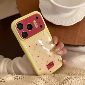 Stylish yellow iPhone 17 case with red accents and colorful star pattern, hand-held detail view