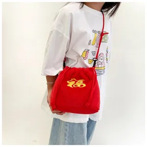 Close-up detail shot of a soft red plush lucky bag crossbody for girls with 'Fu' embroidery
