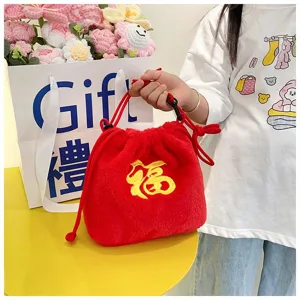 Red plush kids' drawstring bag featuring a gold embroidered Fu character decoration