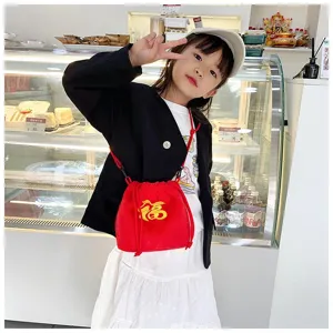 Cute little girl wearing a vibrant red plush fortune bag crossbody in a bright cafe setting