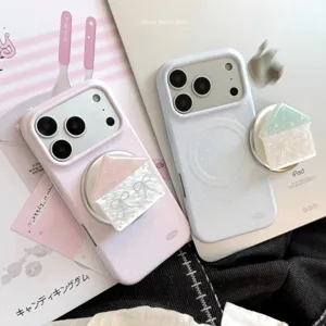 Detailed close-up of a cute house-shaped magnetic phone grip on a pastel polka dot phone case