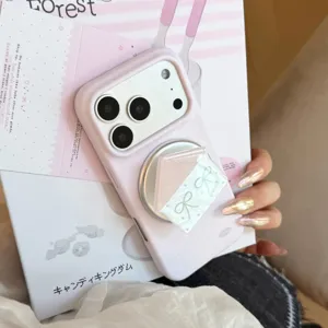Close-up of pink polka dot iPhone case with house-shaped magnetic phone stand