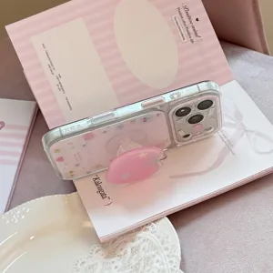 Detailed view of pink apple pattern clear iPhone case with resin heart phone grip
