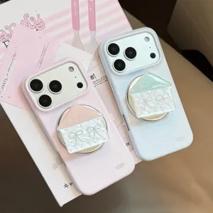 Detail view of pink and blue polka dot iPhone cases with cute magnetic house grips
