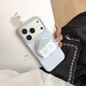 Close-up of baby blue polka dot iPhone case with house-shaped magnetic phone stand