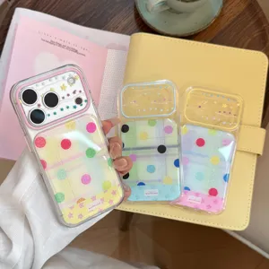 Close-up of colorful dopamine collage iPhone cases with glitter stars and polka dots