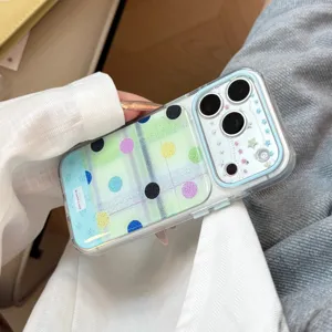 Macro detail view of a clear iPhone case featuring vibrant polka dots and decorative stars