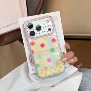 Detailed view of a trendy dopamine collage iPhone case with glitter dots and star accents.