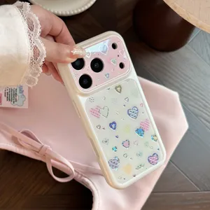 Close-up of heart pattern iPhone case with holographic glitter and pink camera cover.