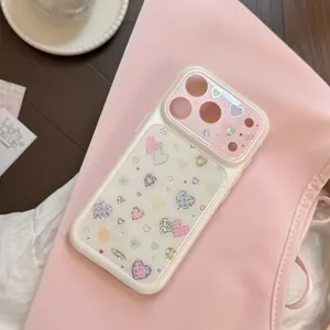 Close-up of pink iPhone case with gilded and glittery heart patterns on pink background