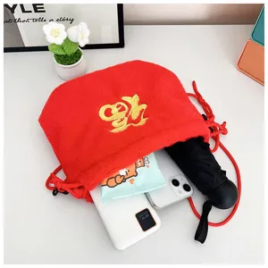 Detailed interior view of red plush lucky pouch bag showing daily items capacity