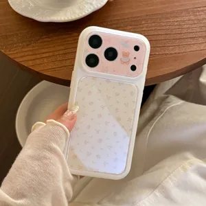 Detailed view of cute floral iPhone case with little bear pattern held by a hand