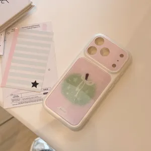 Macro detail view of the Korean style clear glitter iPhone case with a cute green apple design
