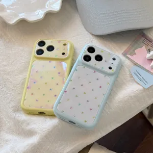 Detail of pastel blue and yellow iPhone cases featuring colorful iridescent stars.