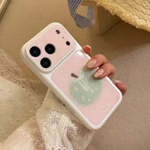 Detail of pink iPhone case with glitter green apple design and large camera window.