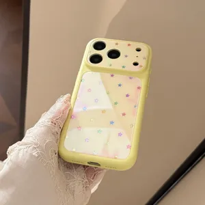 Macro view of a light yellow iPhone case featuring a vibrant and colorful star pattern design