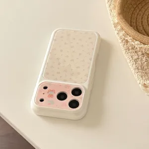 Detailed view of cream iPhone case with floral patterns and cute bear illustration