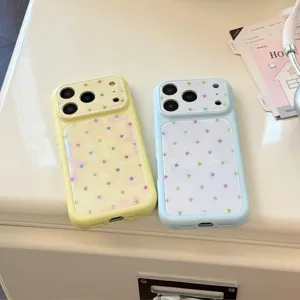 Close-up of pastel yellow and blue iPhone cases featuring colorful star patterns