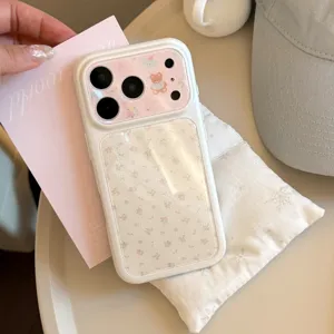 Detail view of a floral bear iPhone case with a pink card and snowflake pillow background