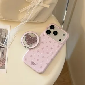 Κοντινή λήψη θήκης iPhone με ροζ φλοράλ σχέδιο και ασορτί στήριγμα καρδιάς.