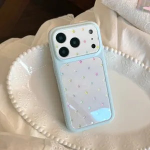 Detailed view of light blue iPhone case decorated with colorful glitter star patterns