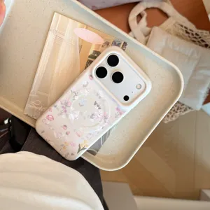 Primer plano de funda de iPhone con estampado de conejo floral y anillo magnético