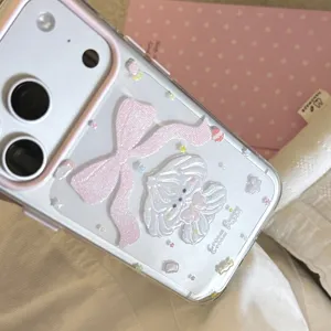 Close-up detail of a 3D embossed pink bow and cute puppy on a clear iPhone case