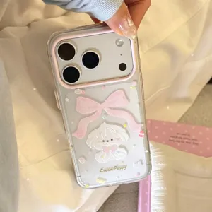 Close-up of cute cream puppy and pink bow design on transparent glitter phone case