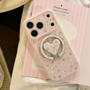 Close-up of pink iPhone case with cute rabbit pattern and heart-shaped ring holder.