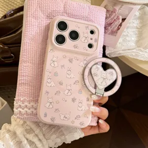 Close-up of pink iPhone case with bunny pattern and heart-shaped MagSafe ring holder