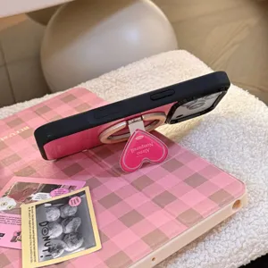 Detailed view of pink striped iPhone case with integrated heart-shaped magnetic stand