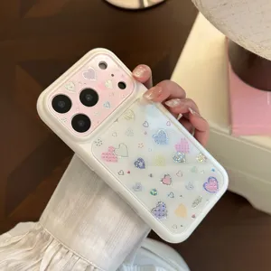 Detail view of iPhone case with cute holographic heart patterns in pink and white
