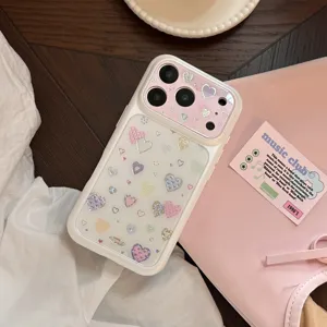 Detail of iPhone case with colorful graffiti heart patterns and golden accents